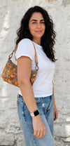 Dark Mosaic Baguette II cork bag worn as a shoulder bag