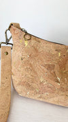 Gold fleck Portuguese cork and antique brass hardware detail on medium crossbody bag
