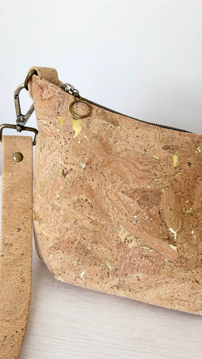 Gold fleck Portuguese cork and antique brass hardware detail on medium crossbody bag