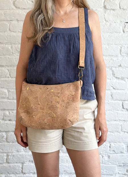 Medium gold fleck cork crossbody bag worn crossbody