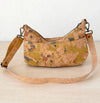 Back of medium light mosaic cork crossbody bag with exterior slip pocket