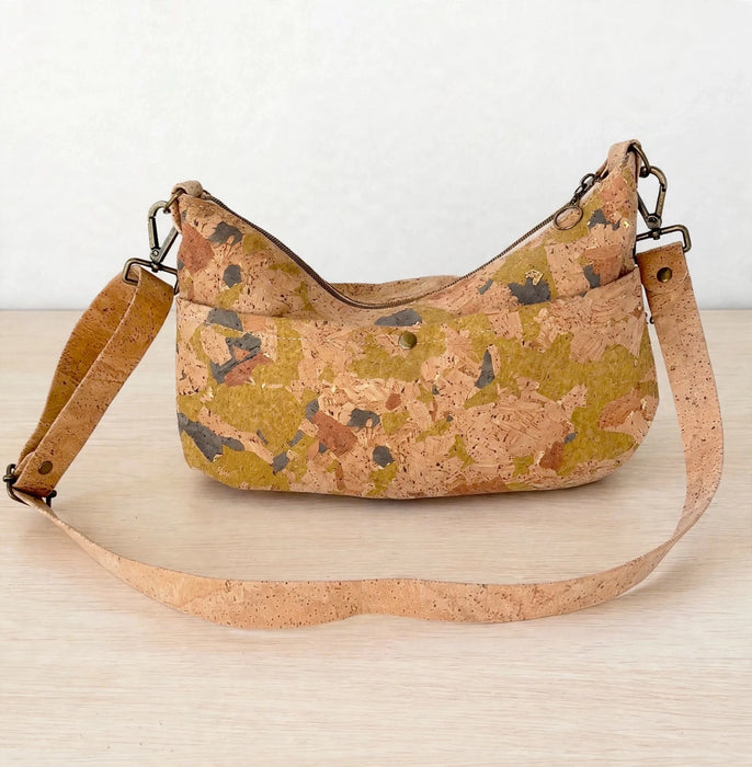 Back of medium light mosaic cork crossbody bag with exterior slip pocket