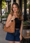 Cognac Gold Fleck cork shoulder bag worn on the shoulder