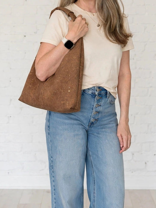 Slouchy Zipper Shoulder Bag in Toffee Portuguese cork with subtle gold flecks shown on a models shoulder