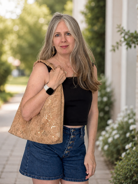 Model wearing the Slouchy Zipper Shoulder Bag in Premium Green Marble Cork